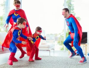 Family dressed in Captain America Costume Playing on Carpet